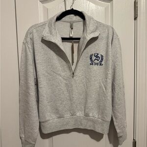 SKIMS Lightweight Fleece Shrunken Half Zip in light heather gray